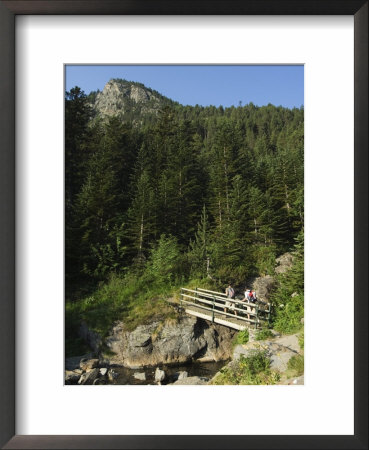 Hikers On Bridge In Hiking Area Of Pic De Coma Pedrosa, Parish Of La Massana, Andorra, Pyrenees by Christian Kober Pricing Limited Edition Print image