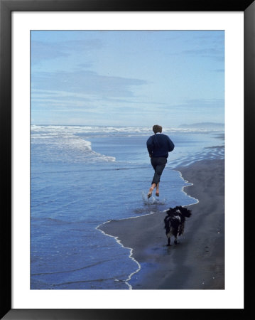 Presidential Candidate Bobby Kennedy And His Dog, Freckles, Running On An Oregon Beach by Bill Eppridge Pricing Limited Edition Print image