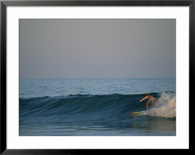 A Woman Surfing In Baja California by Jimmy Chin Pricing Limited Edition Print image