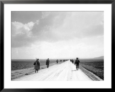 American Soldiers Marching Through The Kasserine Valley During The Fighting In North Africa In Wwii by Eliot Elisofon Pricing Limited Edition Print image