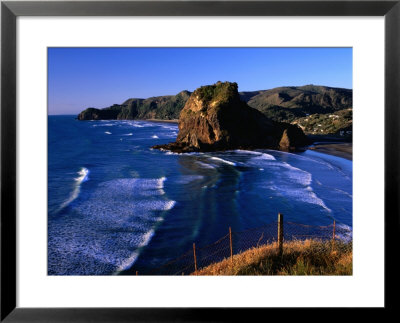 Coastline At Piha Dominated By Lion Rock, New Zealand by Ross Barnett Pricing Limited Edition Print image