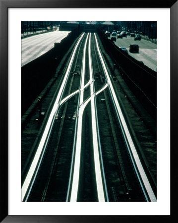 Railway Tracks Under La Defense Square, With Arc De Triomphe In Distance, Paris, France by Izzet Keribar Pricing Limited Edition Print image