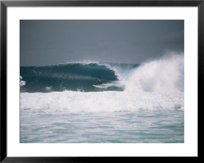 Surfer Riding A Wave In The Bonsai Pipeline In Oahu by Todd Gipstein Pricing Limited Edition Print image