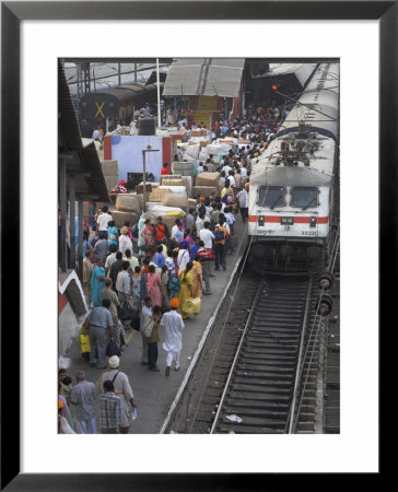 Train Ariving At Crowded Platform In New Delhi Train Station, Delhi, India by Eitan Simanor Pricing Limited Edition Print image