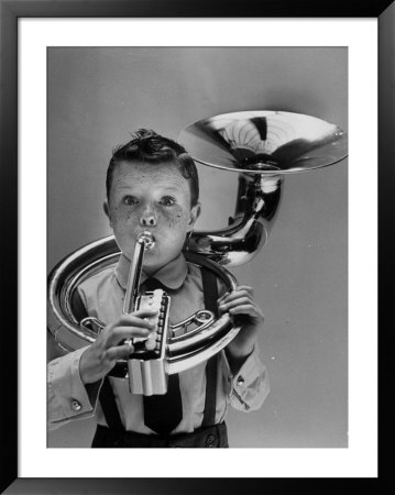Child Playing Musical Instrument by Nina Leen Pricing Limited Edition Print image