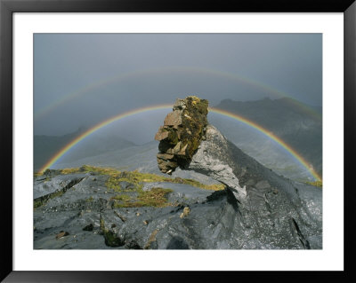 A Rainbow Accents This Bizarre Lava Formation At Ol Doinyo Lengai by Peter Carsten Pricing Limited Edition Print image