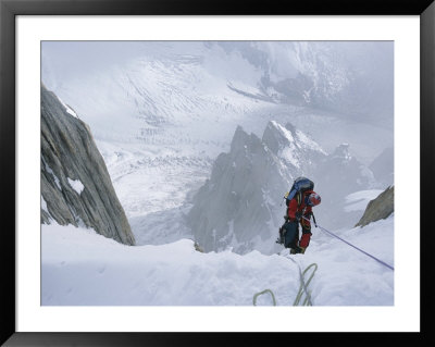 A Man On A Rope In The Karakoram Mountains, Pakistan by Jimmy Chin Pricing Limited Edition Print image