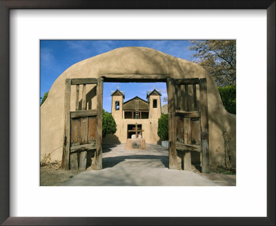A Vintage Gateway Frames The Sanctuario De Chimayo by Stephen St. John Pricing Limited Edition Print image