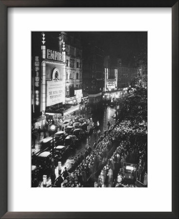 People Waiting In Front Of The Brightly Lighted Empire Theatre For The Royal Film Performance by Cornell Capa Pricing Limited Edition Print image