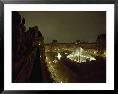 The Pyramid Glows At Night In The Cour Napoleon Iii At The Louvre, France by James L. Stanfield Pricing Limited Edition Print image