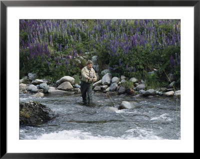 A Fly Fishing Guide Casts His Line Near Coyhaique, Chile by Gordon Wiltsie Pricing Limited Edition Print image
