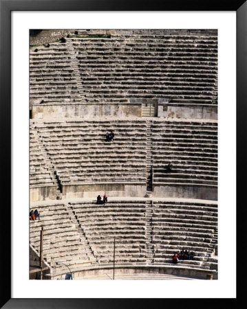 People Enjoy The View From The Ancient Stone Seats Of A Roman Amphitheater by Richard Nowitz Pricing Limited Edition Print image