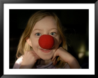 A Young Female Sports A Bright Red Clown Nose by Joel Sartore Pricing Limited Edition Print image