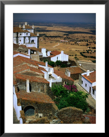 Rooftops And Buildings Of Village Overlooking Countryside, Monsaraz, Portugal by Bethune Carmichael Pricing Limited Edition Print image