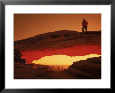 Hiker On Mesa Arch, Canyonlands National Park, Ut by Cheyenne Rouse Pricing Limited Edition Print image