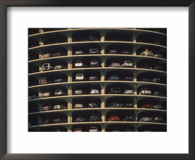 Vehicles Park In A High-Rise Parking Garage by Joel Sartore Pricing Limited Edition Print image