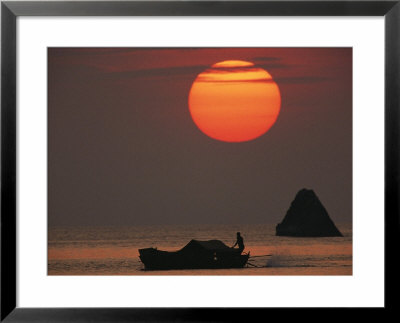Kabang Silhouetted Against The Sea At Sunset by Nicolas Reynard Pricing Limited Edition Print image
