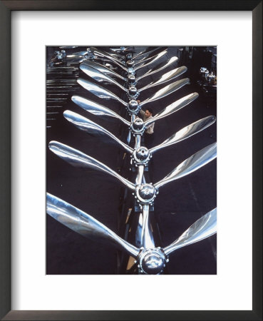 Worker Checking Row Of Gleaming Airplane Propellers At Pratt And Whitney Aircraft Parts Factory by Dmitri Kessel Pricing Limited Edition Print image