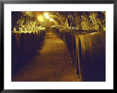 Wine Cellar With Tunnels Of Wooden Barrels And Tokaj Wine, Royal Tokaji Wine Company, Mad, Hungary by Per Karlsson Pricing Limited Edition Print image