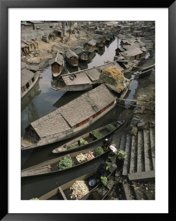Houseboats Line A Waterway Through A Poor Kashmir Town by Gordon Wiltsie Pricing Limited Edition Print image