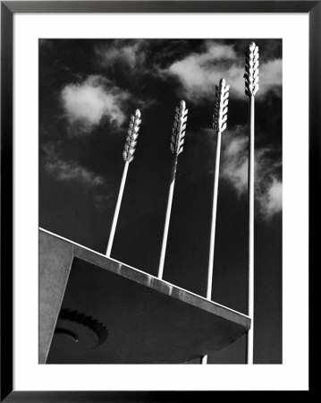 Four Poles Representing Stalks Of Wheat Next To Food Building Before Grand Opening, At World's Fair by Alfred Eisenstaedt Pricing Limited Edition Print image