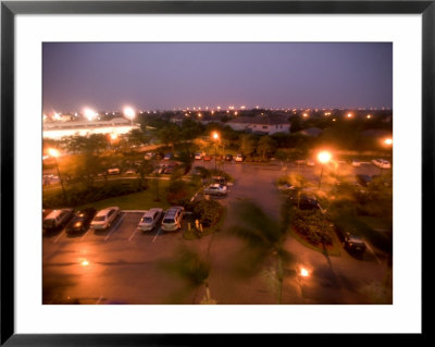 Elevated View Of A Parking Lot At Twilight by Raul Touzon Pricing Limited Edition Print image