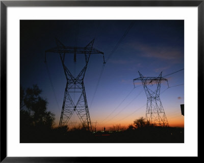 Power Lines And Towers Silhouetted Against The Evening Sky by Taylor S. Kennedy Pricing Limited Edition Print image