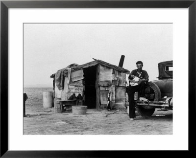 Migrant Father Cradling His Baby Outside Shanty by Dorothea Lange Pricing Limited Edition Print image
