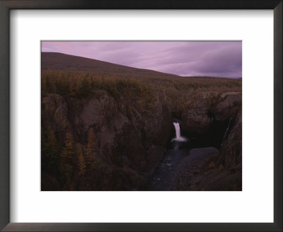 A Waterfall Spills Into The Pristine Waters Of The Lake Below by Randy Olson Pricing Limited Edition Print image