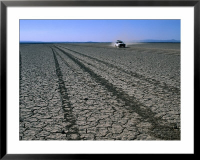 Four-Wheel Drive Vehicle Crossing Desert Plain, Grand Bara, Djibouti by Frances Linzee Gordon Pricing Limited Edition Print image