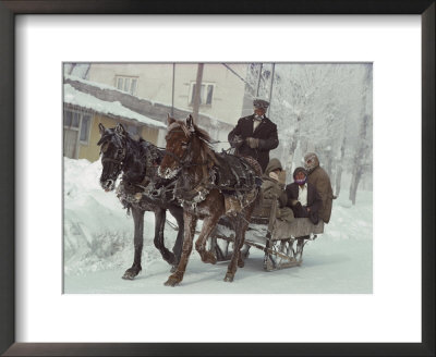 A Sleigh Serves As A Taxi On A Snow-Covered Village Street by Gordon Gahan Pricing Limited Edition Print image