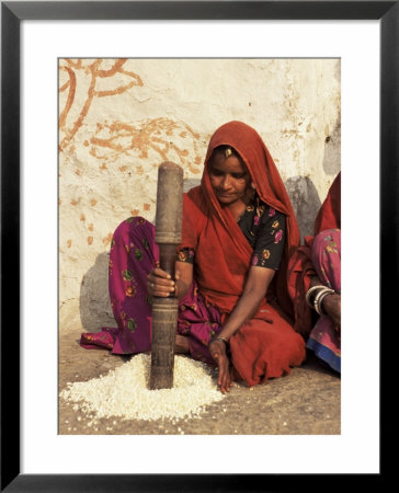 Woman Pounding Food In Village Near Deogarh, Rajasthan State, India by Robert Harding Pricing Limited Edition Print image