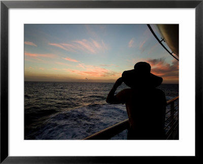 Silhouette Of A Woman On A Cruise Ship Looking At The Sunset by Todd Gipstein Pricing Limited Edition Print image