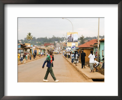 Man Crossing Road And People On Footpath, Kigali, Rwanda by Ariadne Van Zandbergen Pricing Limited Edition Print image