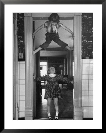Denise Bruene Climbing Kitchen Door In Bare Feet, Her Hobby, Jan Bruene Says Don't Fall On Me by Gordon Parks Pricing Limited Edition Print image