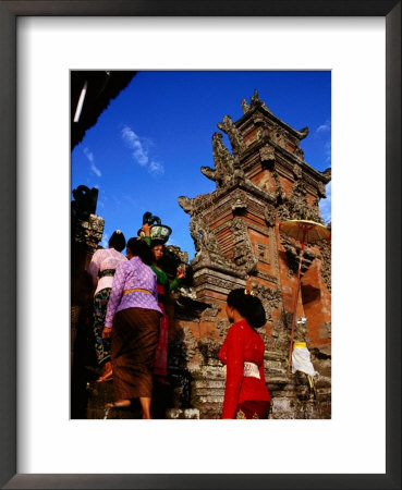 Women Bearing Offerings At Tagtag Temple, Denpasar, Indonesia by Tom Cockrem Pricing Limited Edition Print image