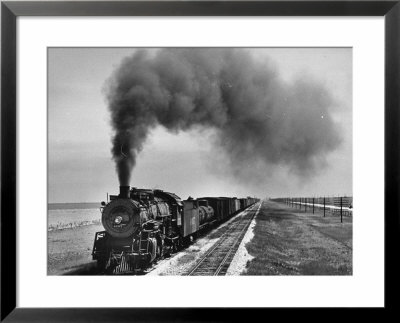 View Of A Freight Train Crossing An Open Prairie by Thomas D. Mcavoy Pricing Limited Edition Print image