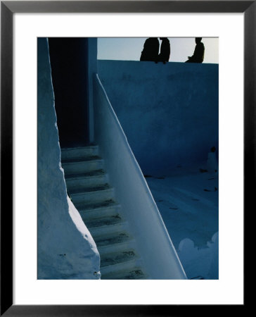 Men Sitting On Wall With Staircase, Asilah, Morocco by Jeffrey Becom Pricing Limited Edition Print image