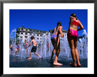 Children Playing In Piccadilly Gardens Waterjets, Manchester, England by Mark Daffey Pricing Limited Edition Print image