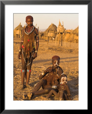 Karo Women With Child Wearing Traditional Goatskin Dress Decorated With Cowrie Shells by Jane Sweeney Pricing Limited Edition Print image