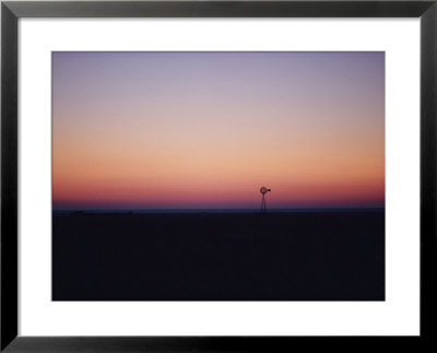 A Windmill Breaks The Flat Horizon Of The Texas Panhandle At Dawn by George F. Mobley Pricing Limited Edition Print image