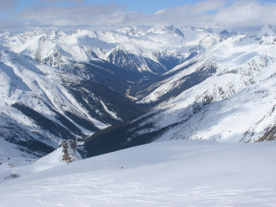 A Back-Country Snowboarder Descends A Snowfield Near Rogers Pass by Skip Brown Pricing Limited Edition Print image