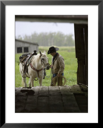 Cowboy And Horse In The Rain, Judith Gap, Montana, Usa by Chuck Haney Pricing Limited Edition Print image