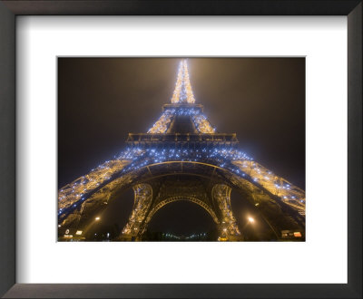 Looking Up At Eiffel Tower In Fog And Rain At Night, Paris, France by Jim Zuckerman Pricing Limited Edition Print image