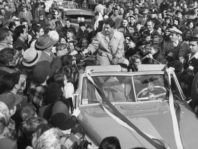 Heavyweight Boxer Rocky Marciano Sitting In Convertible Next To Wife After Victory Over Joe Louis by Fred Bauman Pricing Limited Edition Print image