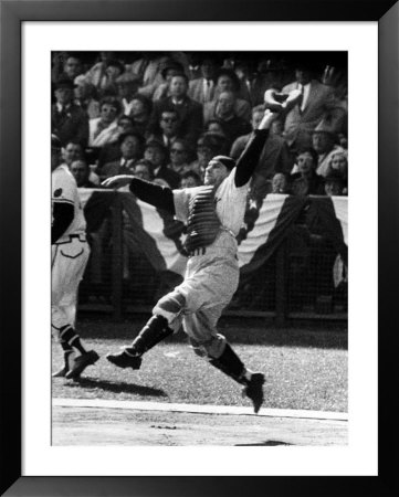 New York Yankee Player Yogi Berra Catching A Ball During A 1958 World Series Game by Francis Miller Pricing Limited Edition Print image