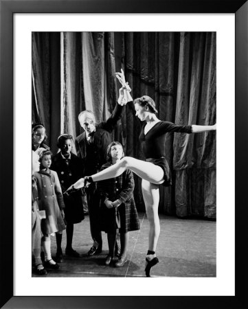 Choreographer George Balanchine Working With A Ballet Dancer While Several Young Girls Look On by John Loengard Pricing Limited Edition Print image