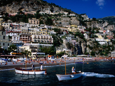 Houses Terraced Into Rugged Amalfi Coastline, Boats In Foreground, Positano, Italy by Dallas Stribley Pricing Limited Edition Print image