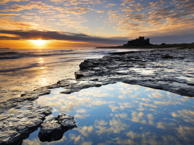 Sunrise On Coast Near Bamburgh Castle, Northumberland, England by Adam Burton Pricing Limited Edition Print image
