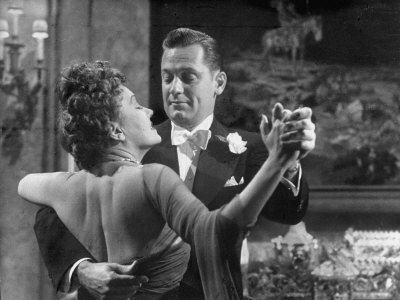 Actors William Holden And Gloria Swanson Dancing In Scene From Sunset Boulevard by J. R. Eyerman Pricing Limited Edition Print image